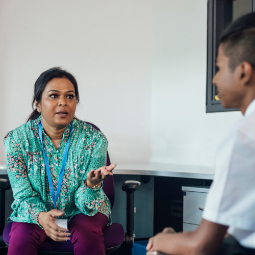 Teacher talking to student